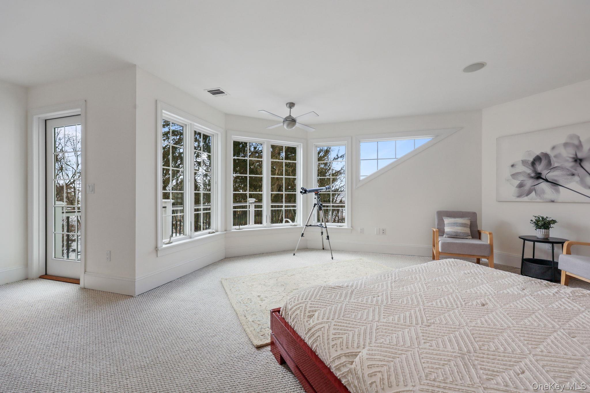 1320 Albany Post Road Croton-on-Hudson, NY 10520 - Photo 22 of 40 a bedroom with a large bed and a window