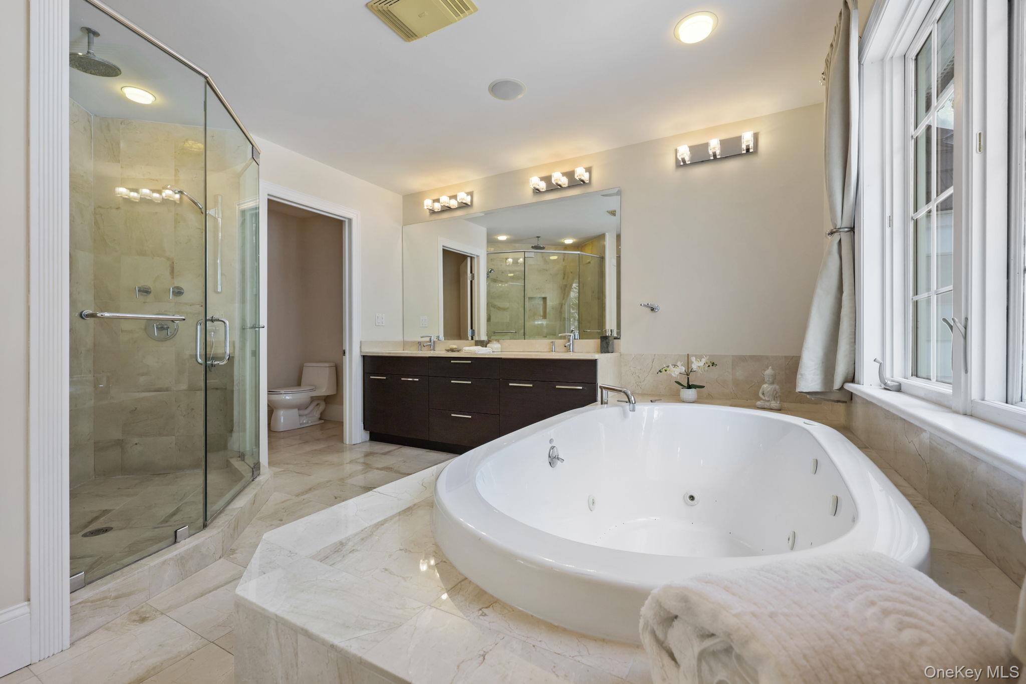 1320 Albany Post Road Croton-on-Hudson, NY 10520 - Photo 23 of 40 a bathroom with a bathtub and a shower