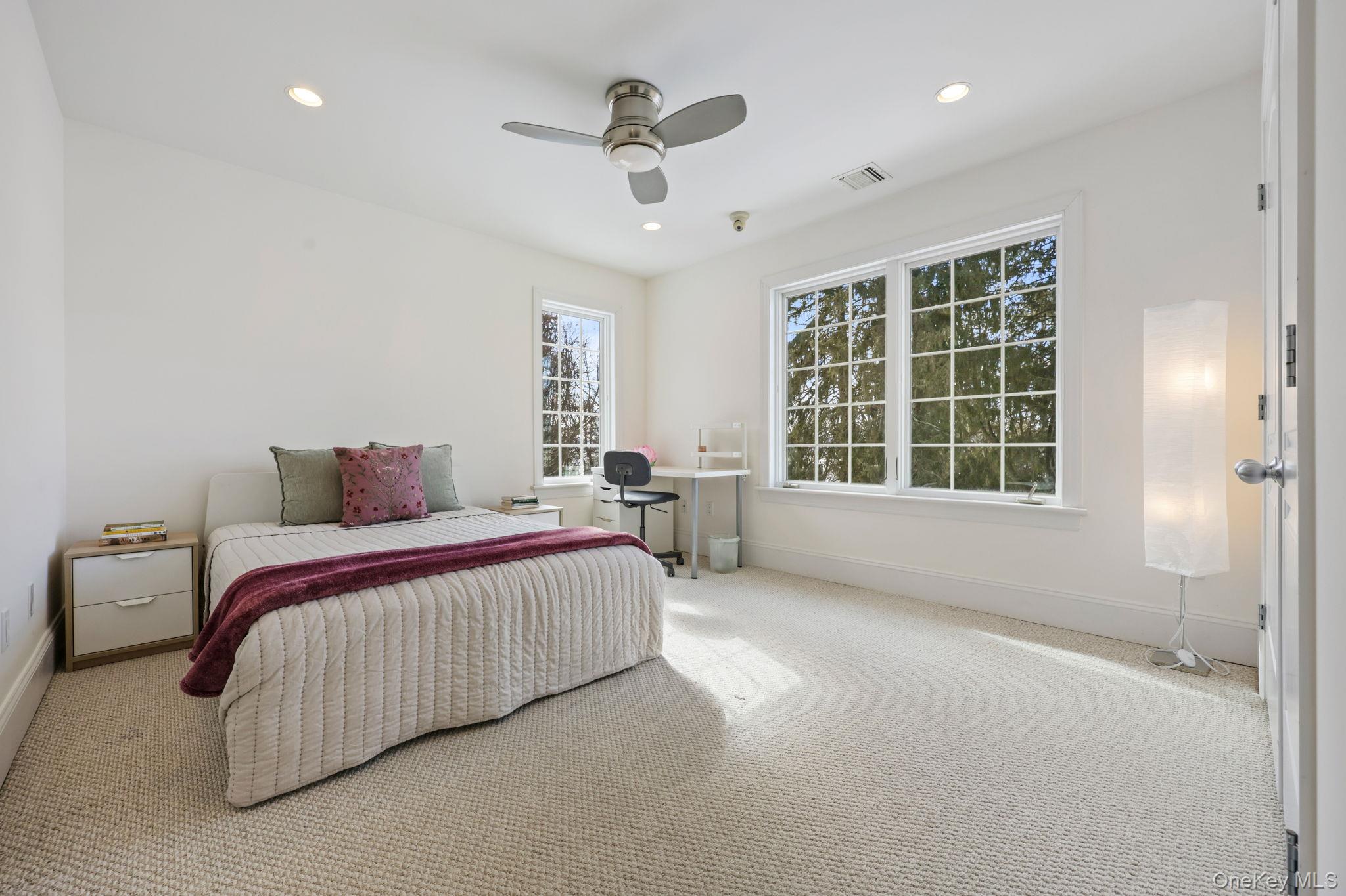 1320 Albany Post Road Croton-on-Hudson, NY 10520 - Photo 25 of 40 a spacious bedroom with a bed and a large window