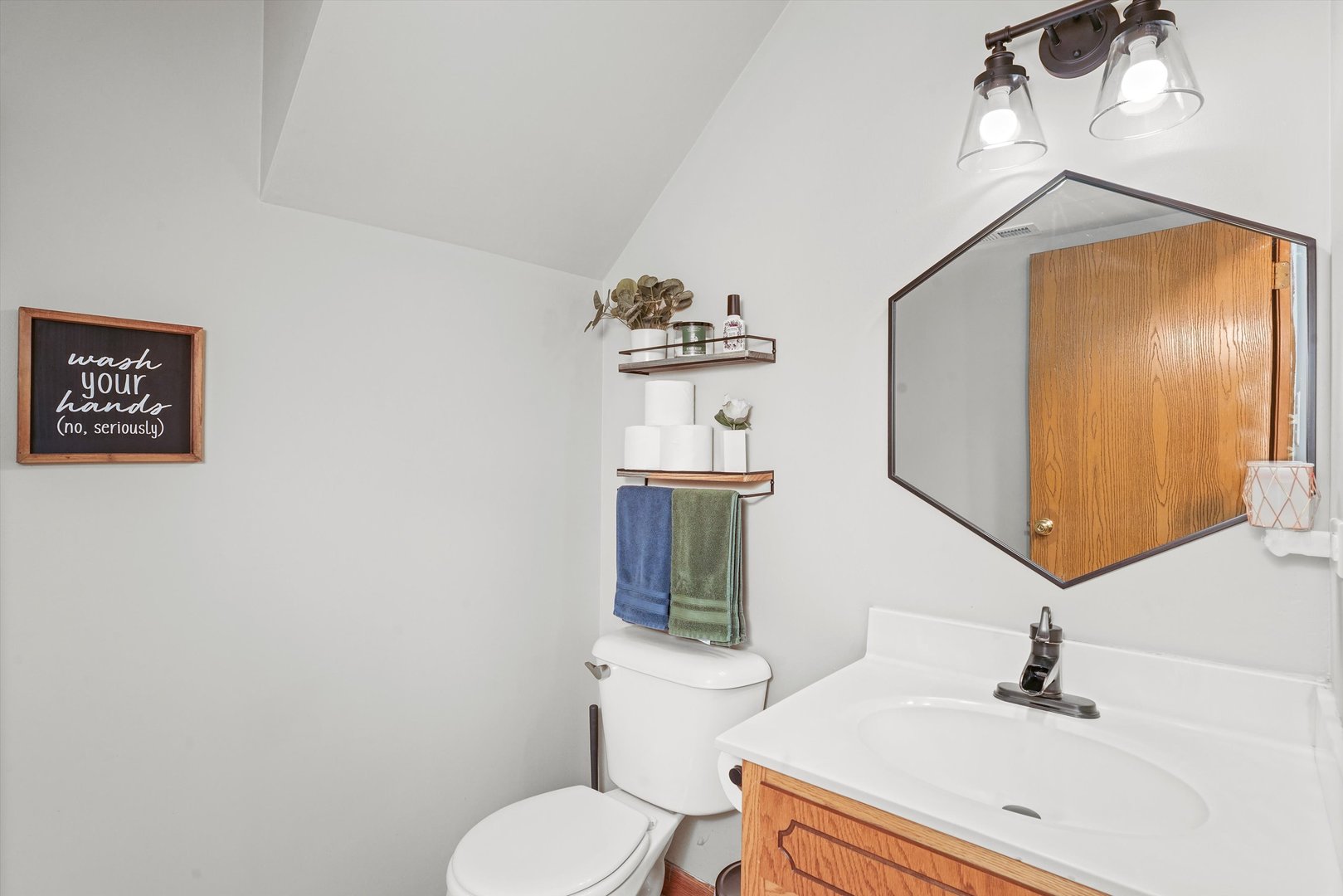 12554 Arbor Drive Alsip, IL 60803 - Photo 11 of 28 a bathroom with a sink vanity mirror and toilet