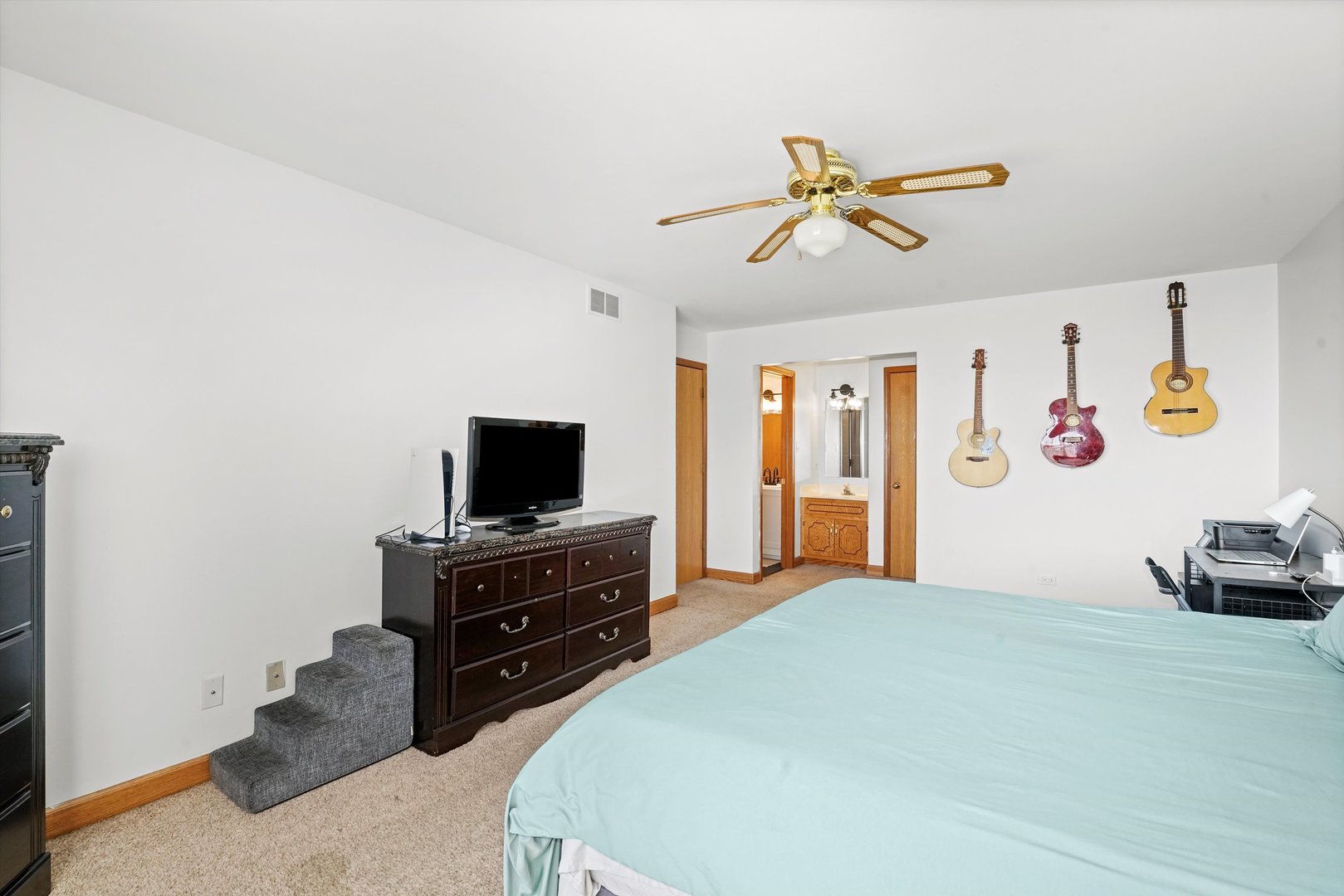 12554 Arbor Drive Alsip, IL 60803 - Photo 14 of 28 a bedroom with a bed and a flat screen tv