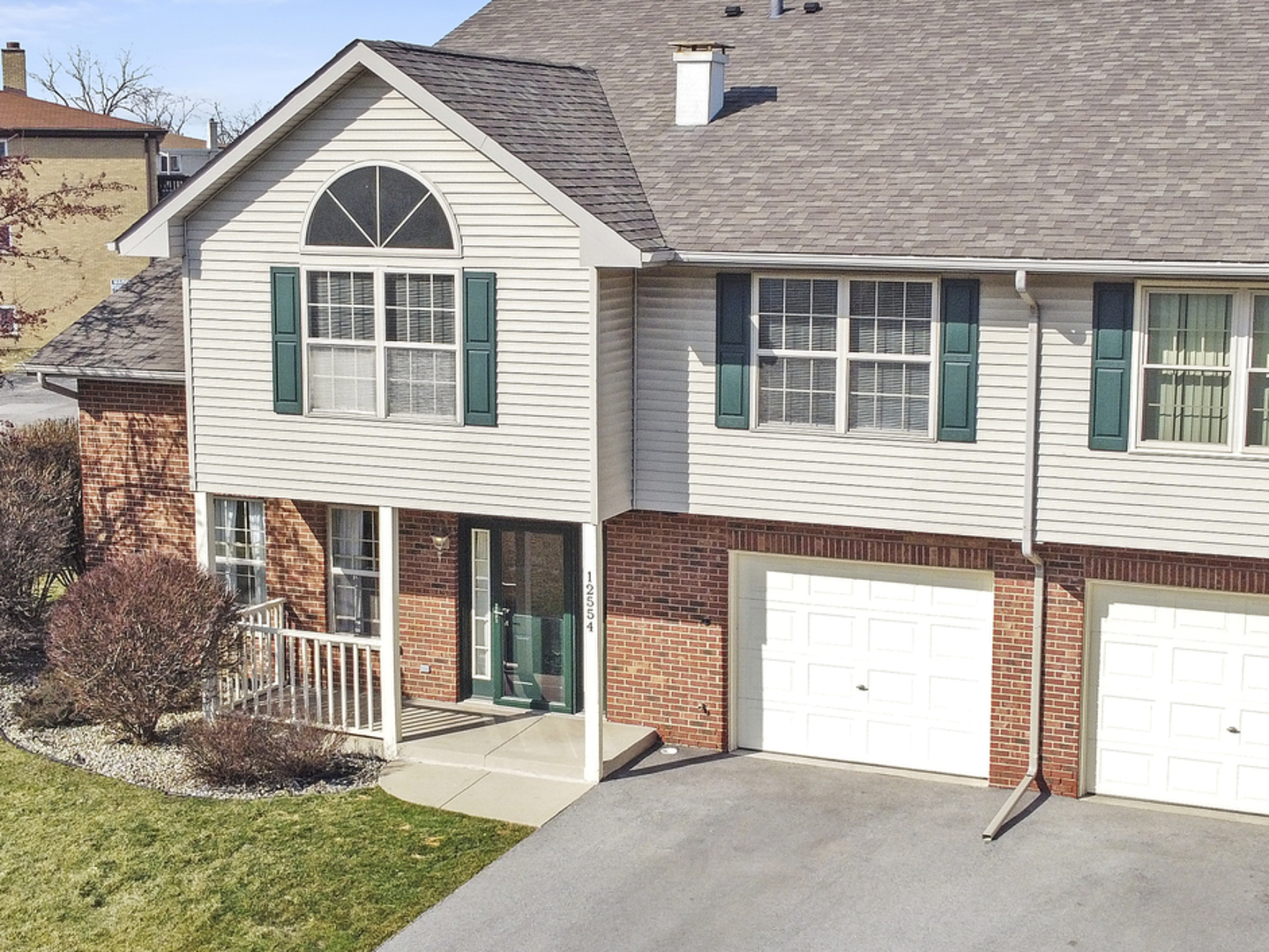 12554 Arbor Drive Alsip, IL 60803 - Photo 2 of 28 a front view of a house with a yard