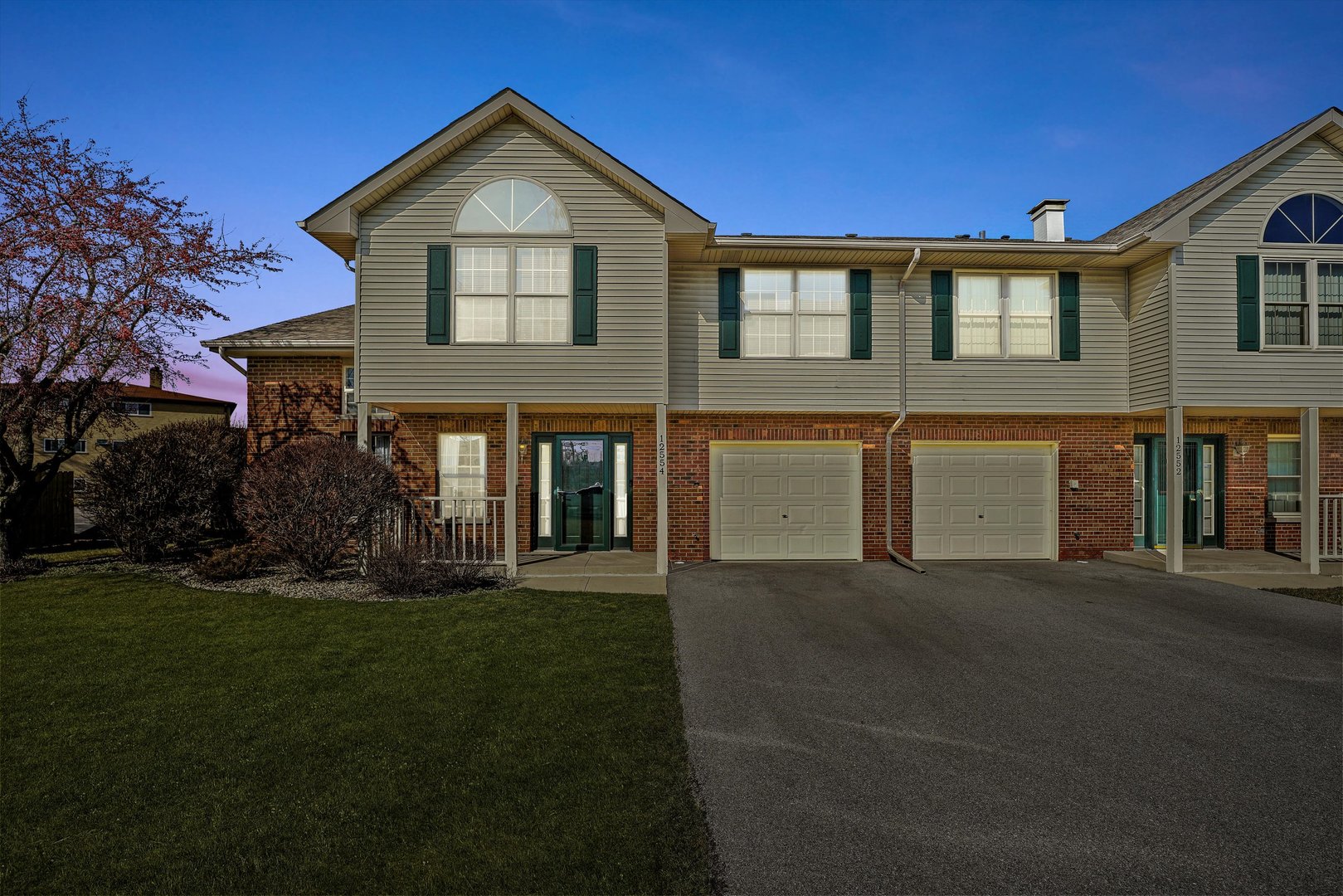 12554 Arbor Drive Alsip, IL 60803 - Photo 25 of 28 a front view of a house with a yard