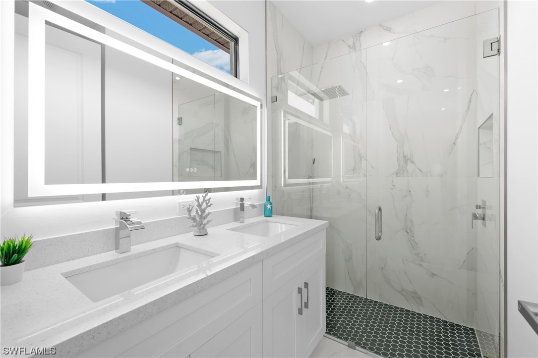 2917 Nelson Road North Cape Coral, FL 33993 - Photo 16 of 25 a bathroom with a sink a toilet and shower