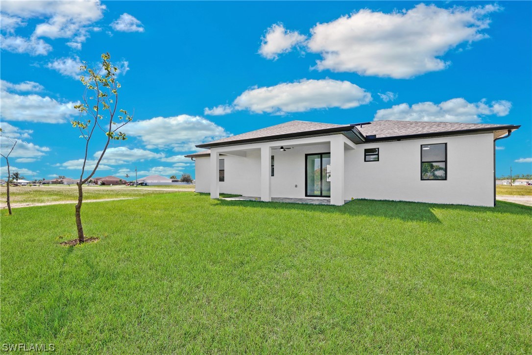 2917 Nelson Road North Cape Coral, FL 33993 - Photo 24 of 25 a view of a backyard with a garden