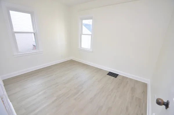 an empty room with windows