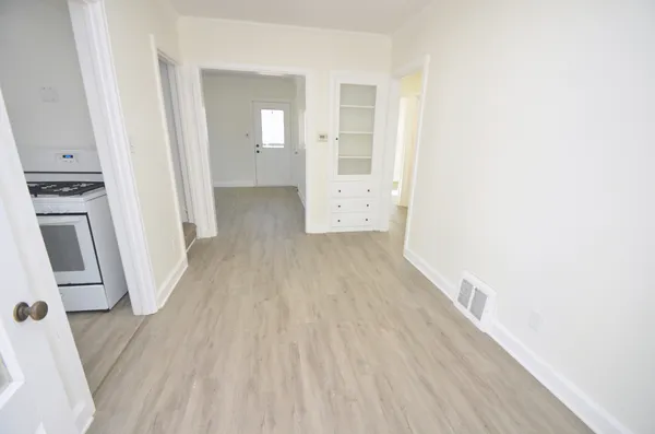 a view of a kitchen from a hallway