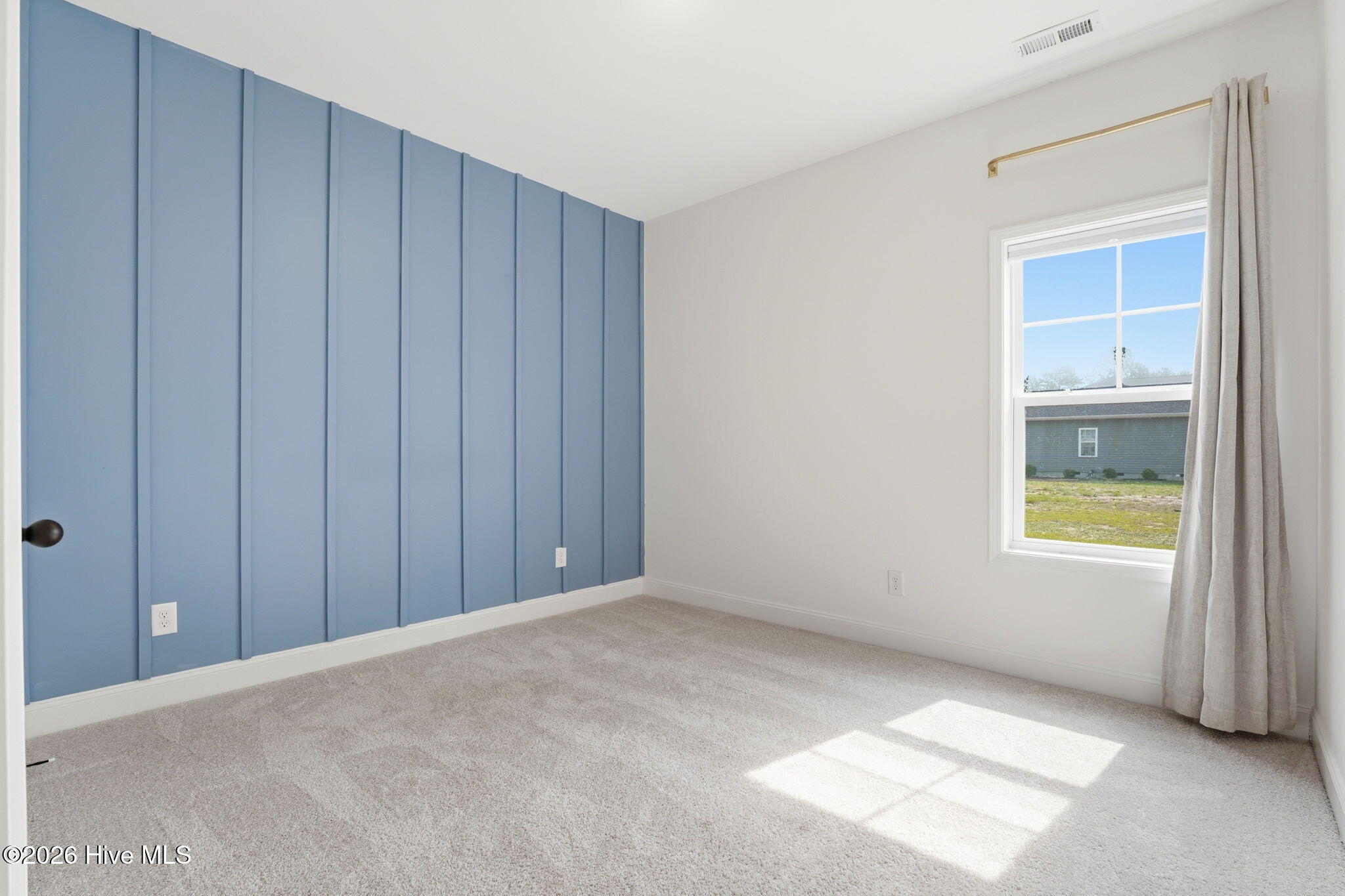 44 Richmond Road Jackson Springs, NC 27281 - Photo 8 of 24 Second bedroom - with a beautiful blue accent wall