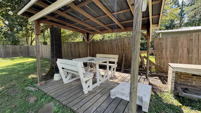 a view of a chairs and table in the patio