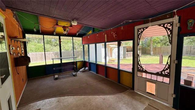 a room with furniture and a large window