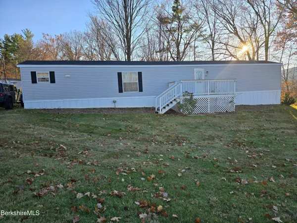 a view of a house with a back yard