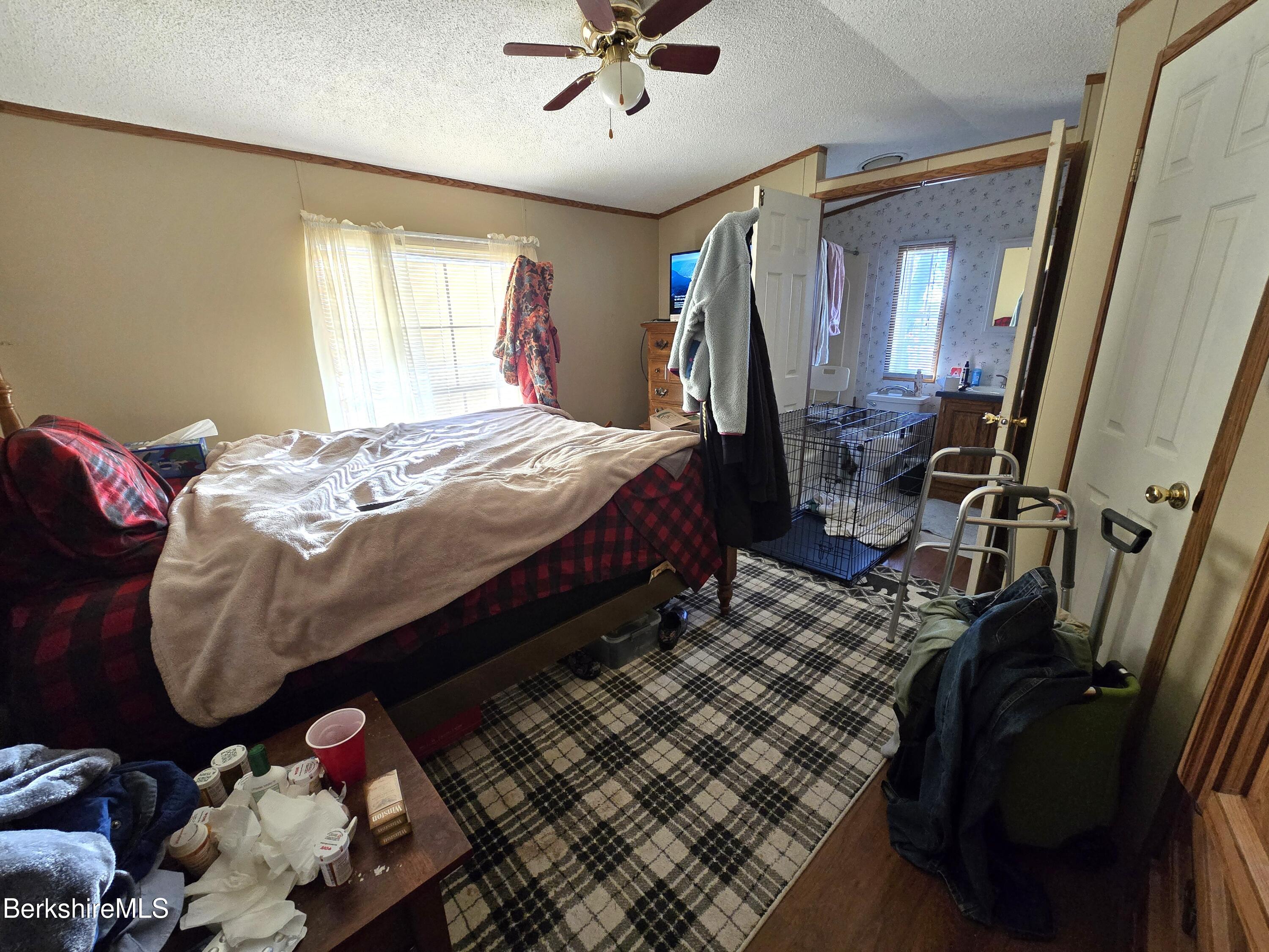 108 Baker Drive Bennington, VT 05201 - Photo 13 of 17 a bed sitting in a bedroom next to a window