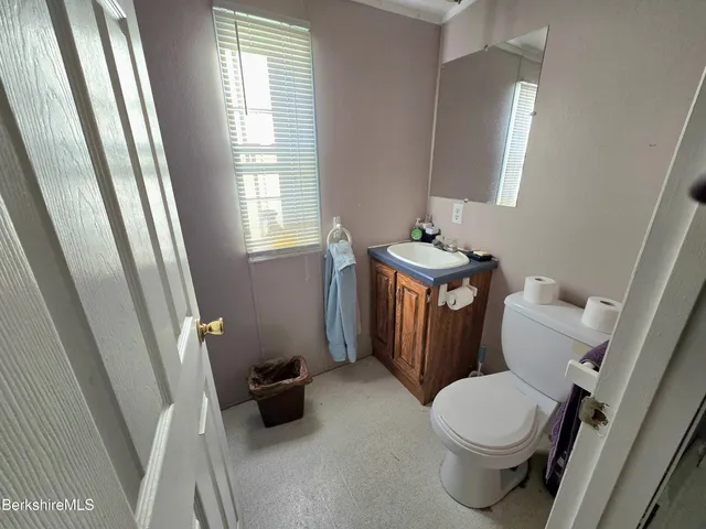 a bathroom with a toilet and a sink