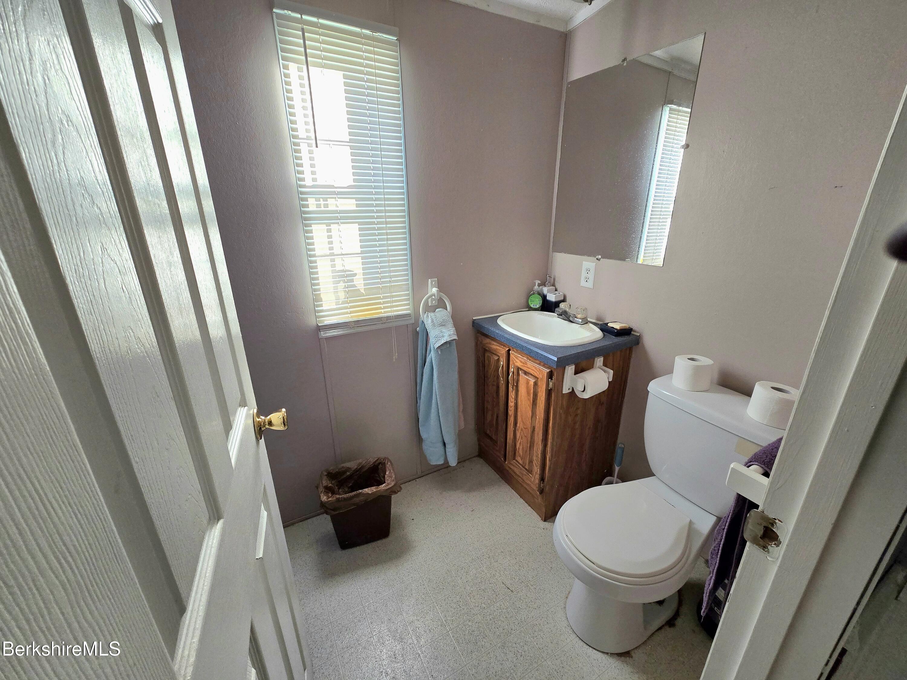 108 Baker Drive Bennington, VT 05201 - Photo 16 of 17 a bathroom with a toilet and a sink