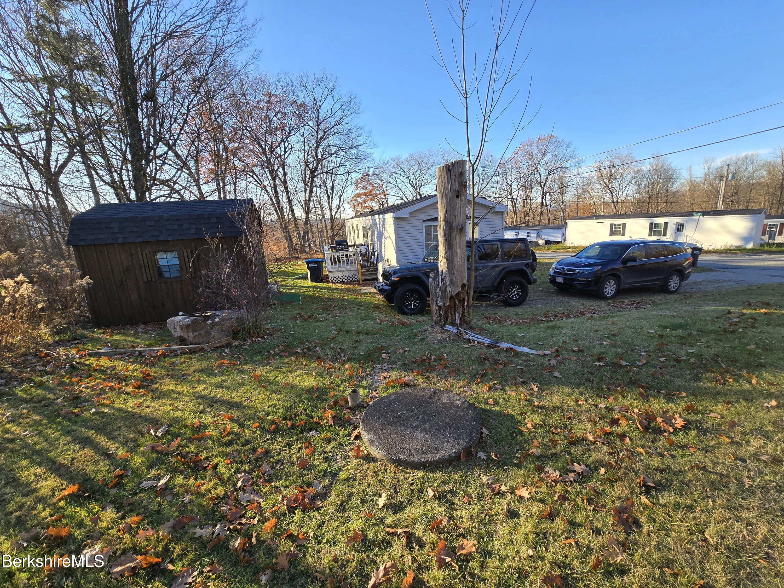 108 Baker Drive Bennington, VT 05201 - Photo 3 of 17 a view of a backyard with sitting area