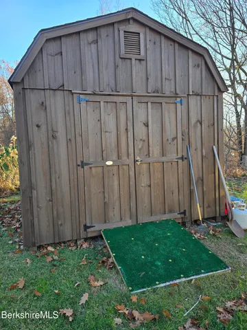a wooden fence with a small yard