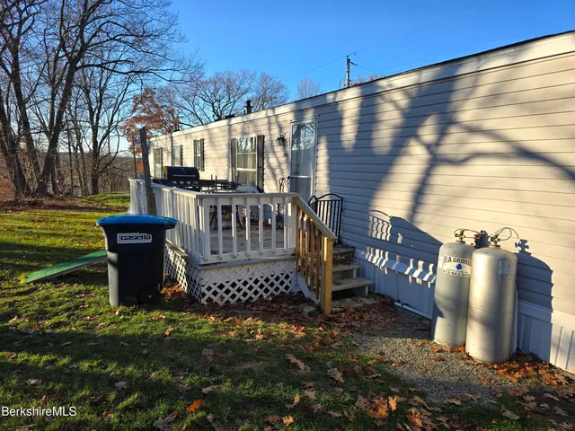 a view of a bench in the backyard