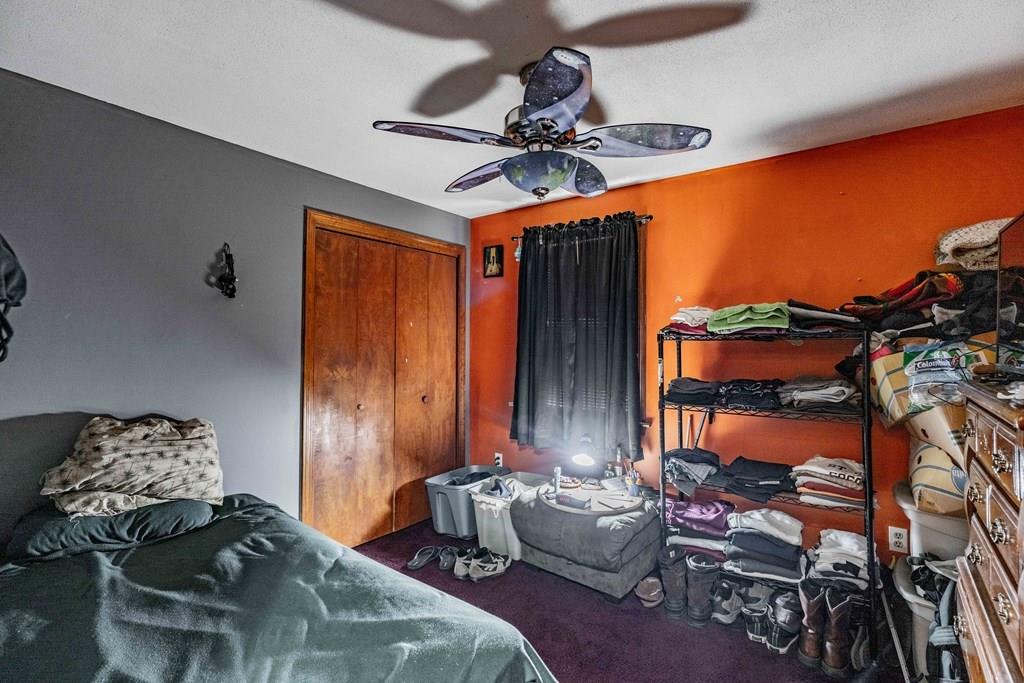 71 Ann Street Chicopee, MA 01020 - Photo 14 of 16 a bedroom with furniture and a chandelier