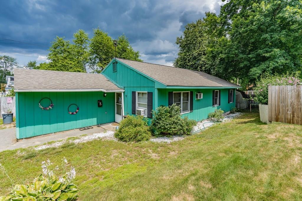 71 Ann Street Chicopee, MA 01020 - Photo 2 of 16 a front view of a house with garden
