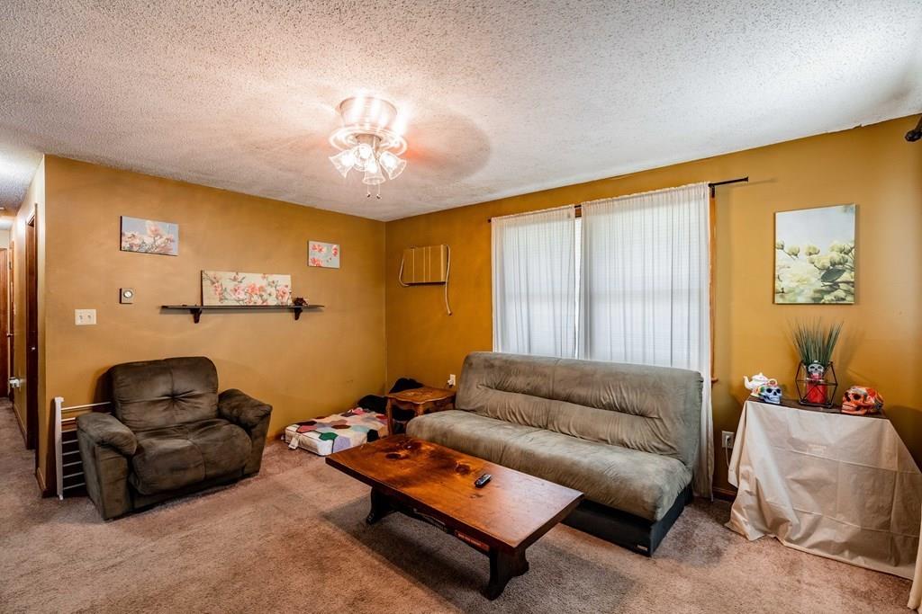 71 Ann Street Chicopee, MA 01020 - Photo 5 of 16 a living room with furniture and a large window