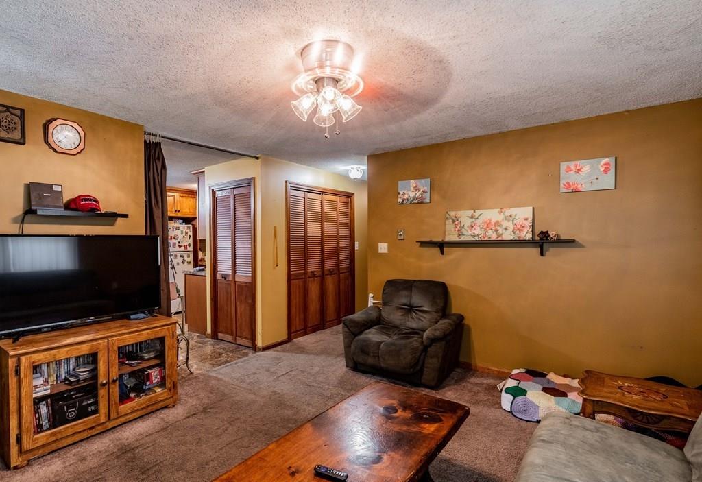 71 Ann Street Chicopee, MA 01020 - Photo 7 of 16 a living room with furniture and a flat screen tv