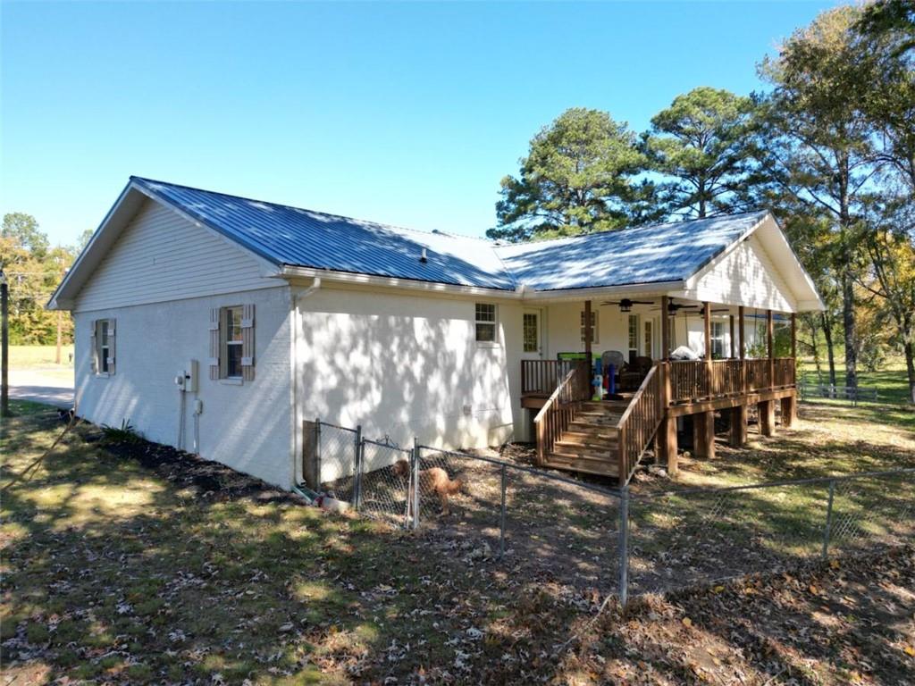 2053 Buttermilk Road Southwest Cave Spring, GA 30124 - Photo 11 of 50 a view of a chairs and table in a backyard
