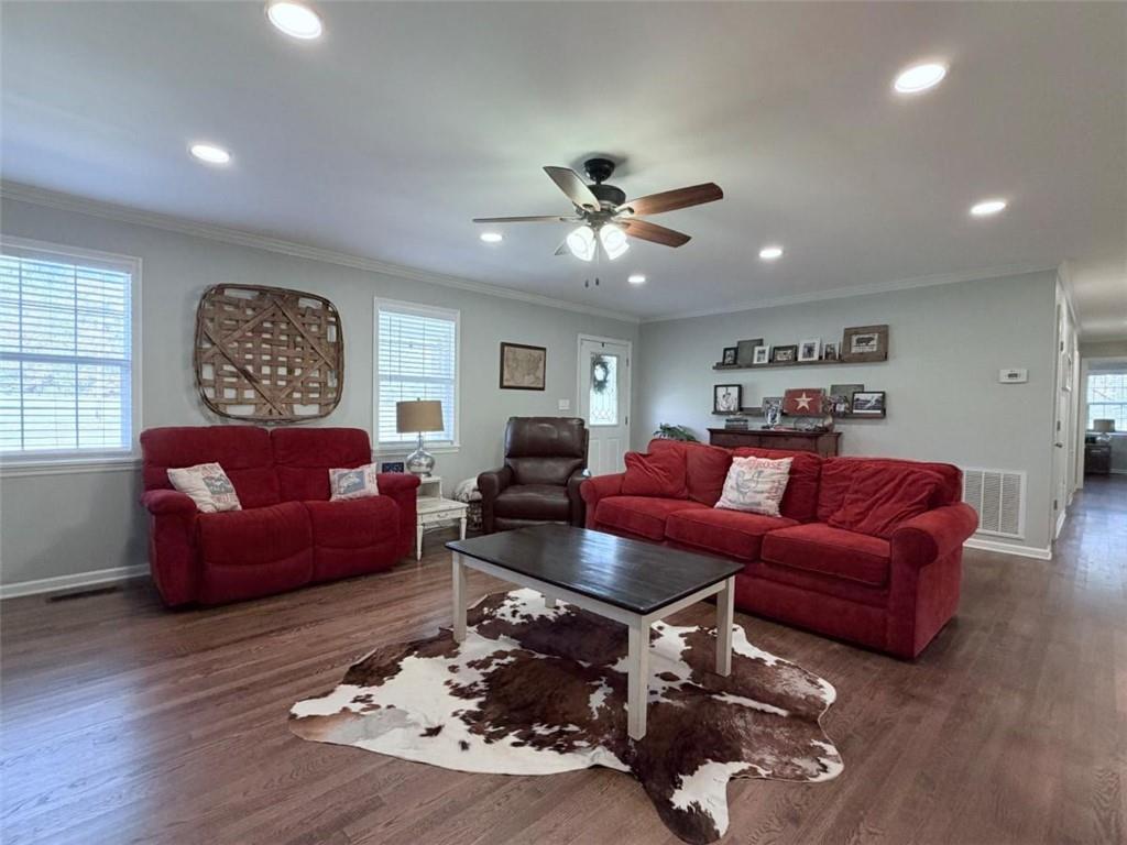 2053 Buttermilk Road Southwest Cave Spring, GA 30124 - Photo 19 of 50 a living room with furniture ceiling fan and a wooden floor