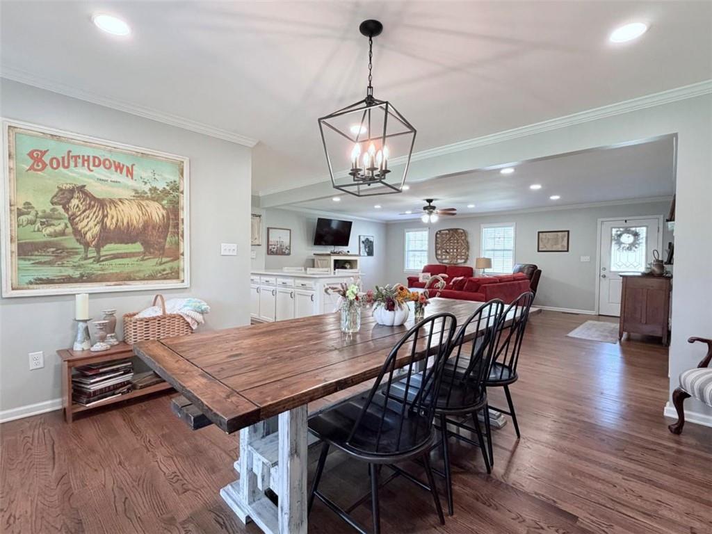 2053 Buttermilk Road Southwest Cave Spring, GA 30124 - Photo 24 of 50 a view of a dining room with furniture wooden floor and chandelier