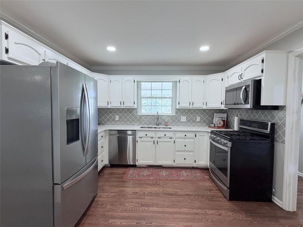 2053 Buttermilk Road Southwest Cave Spring, GA 30124 - Photo 25 of 50 a kitchen with a refrigerator stove and microwave