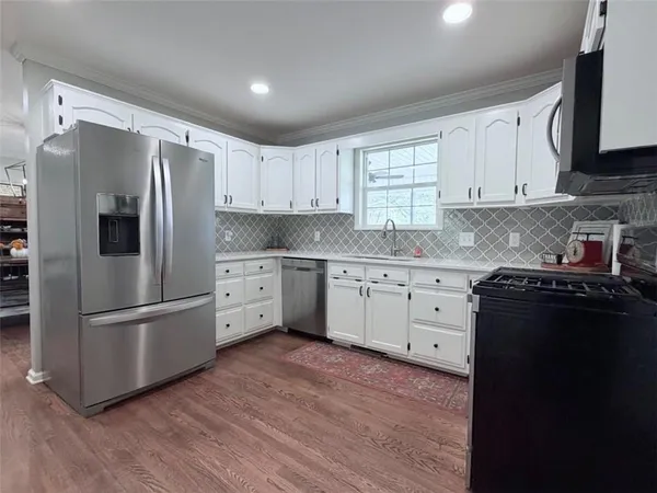 a bedroom with a bed and a desk