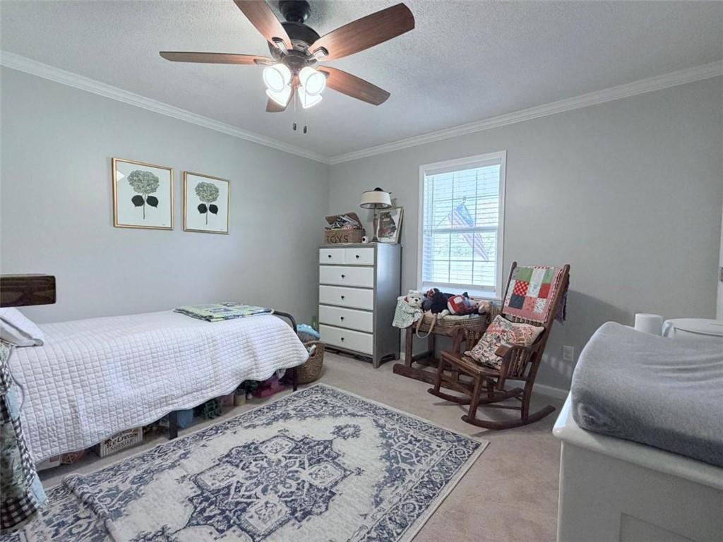 2053 Buttermilk Road Southwest Cave Spring, GA 30124 - Photo 37 of 50 a bed room with a bed and furniture