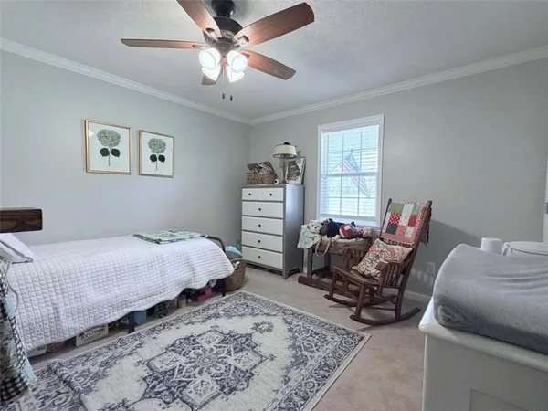 a spacious bathroom with a tub sink and mirror