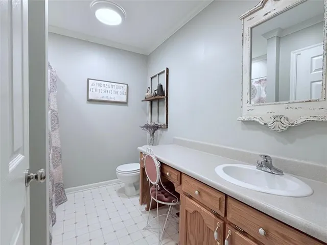 a bathroom with a sink and a toilet