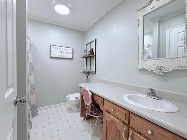 a en suite bathroom with a granite countertop tub and a sink