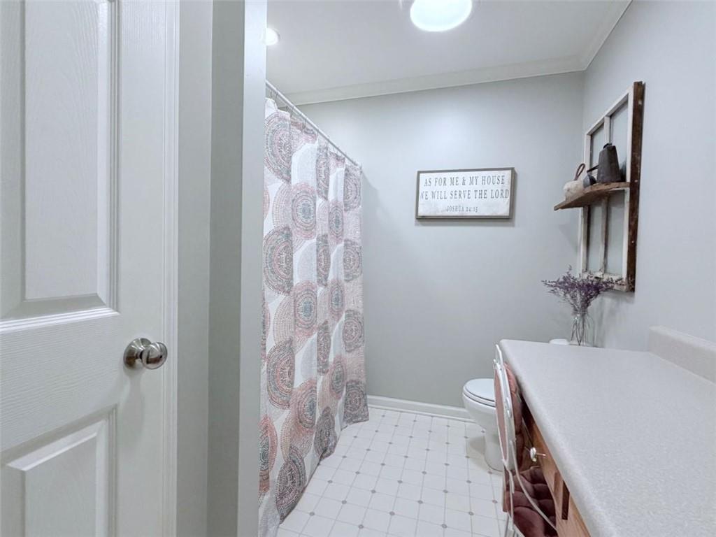 2053 Buttermilk Road Southwest Cave Spring, GA 30124 - Photo 40 of 50 a bathroom with a sink a mirror and a shower