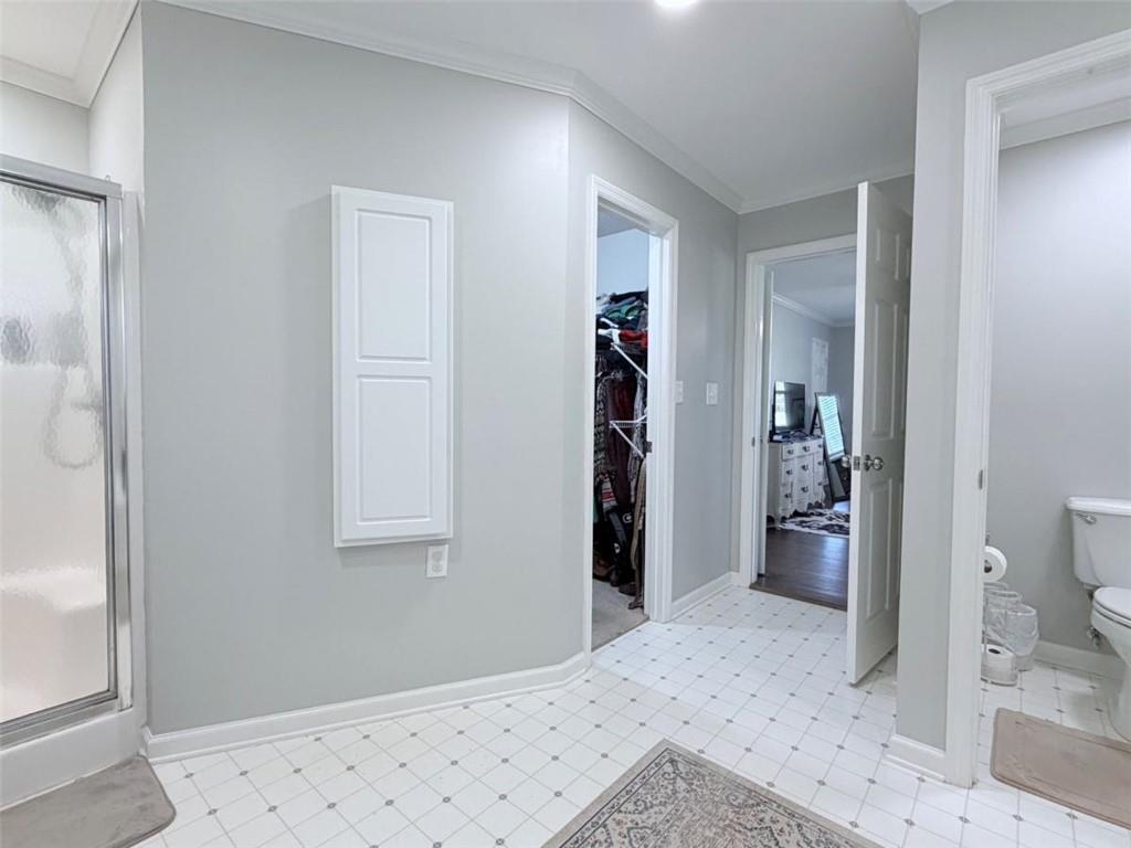 2053 Buttermilk Road Southwest Cave Spring, GA 30124 - Photo 46 of 50 a bedroom with a bed and a view of bathroom