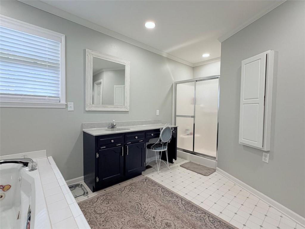 2053 Buttermilk Road Southwest Cave Spring, GA 30124 - Photo 51 of 69 a bathroom with a sink vanity granite tub and a mirror