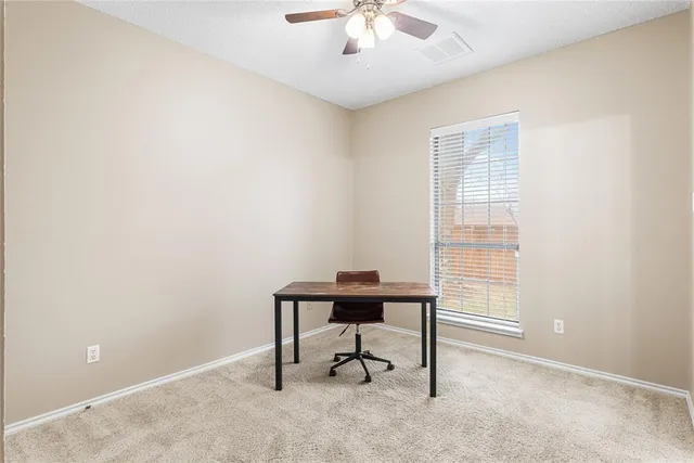 a workspace with furniture and a window