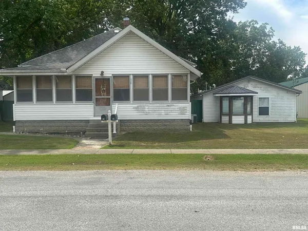 a house with swimming pool in front of it