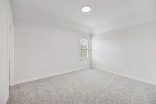 an empty room with a empty space and window