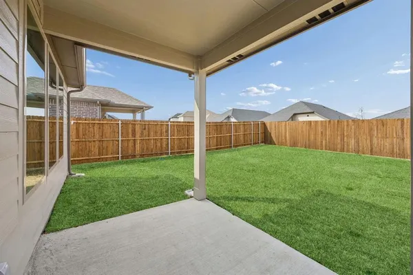 a view of a back yard of the house