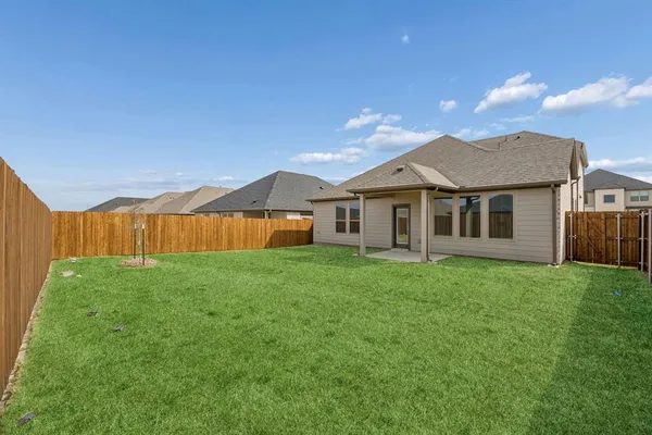 a view of a yard in front of a house