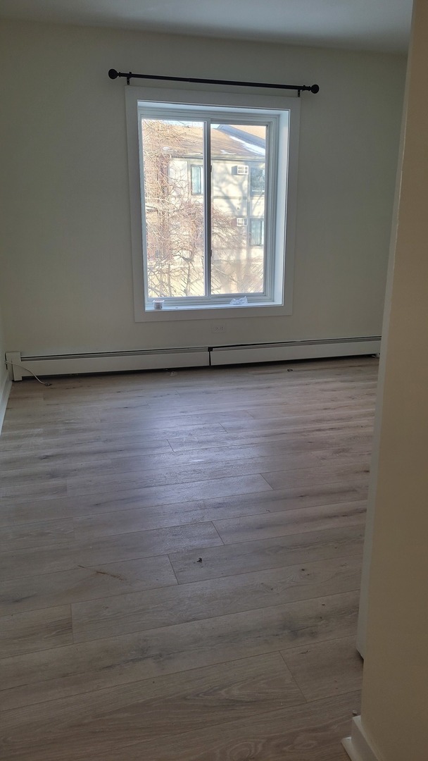 514 Kiowa Circle, Unit 204 Naperville, IL 60565 - Photo 8 of 8 a view of a room with wooden floor and windows