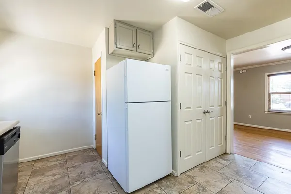 a kitchen with stainless steel appliances a stove and a refrigerator