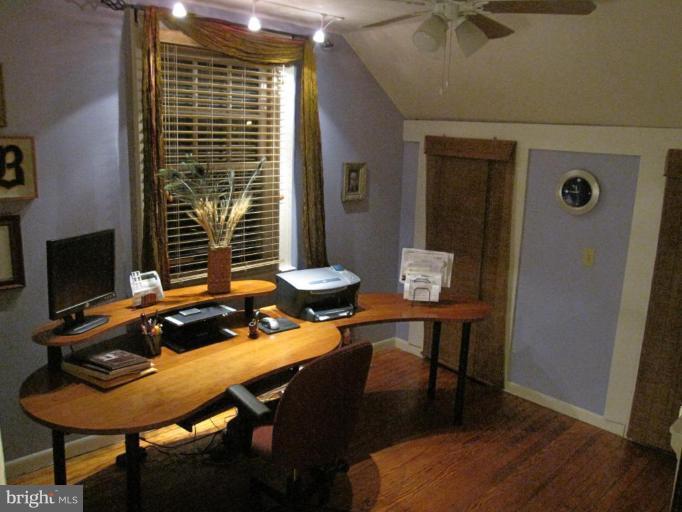 725 Hollen Road Baltimore, MD 21212 - Photo 11 of 12 a table and chairs in a room next to a window