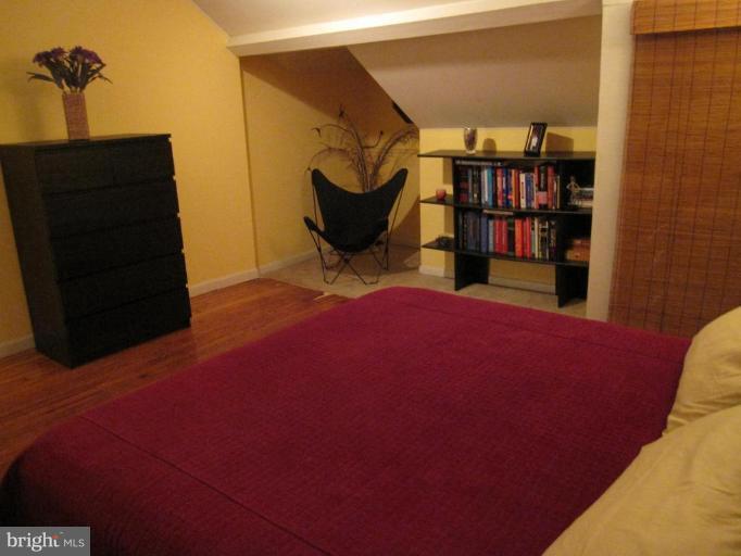 725 Hollen Road Baltimore, MD 21212 - Photo 6 of 12 a view of a bedroom with clothes and shoes