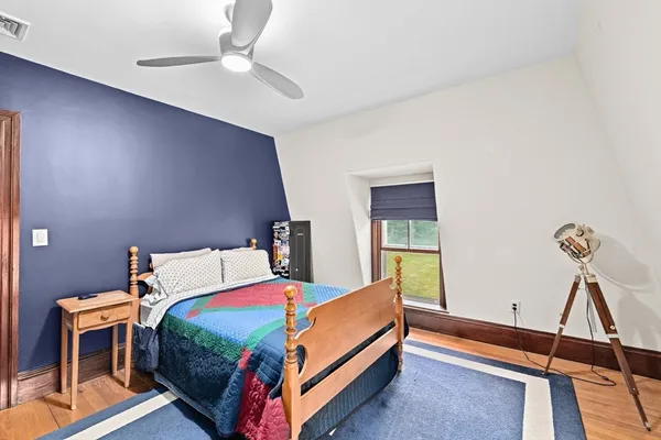 a bed room with a bed and a chandelier