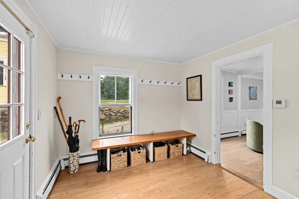 a view of a livingroom with furniture and a window