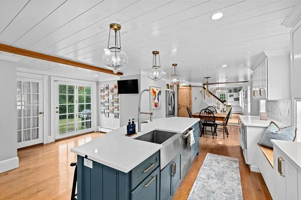 a very nice looking living room with wooden floor and a window