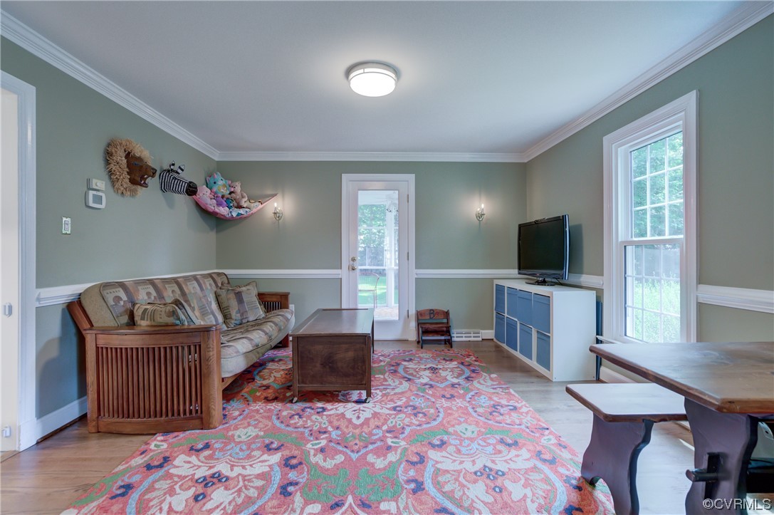 2615 Radstock Road Midlothian, VA 23113 - Photo 23 of 42 a living room with furniture and a flat screen tv